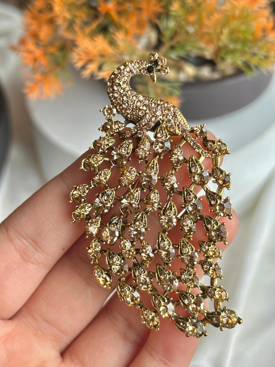 Gold strass peacock brooch
